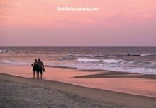 Couple doing a Sunset Walk on Beach