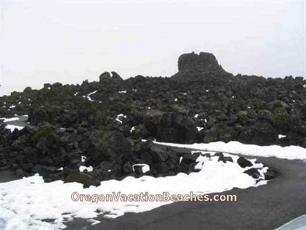 Lookout structure made of black volcanic rocks at Volcanic area peak