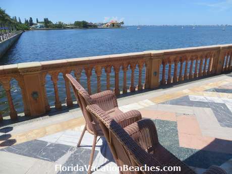 Chairs on back side of Ringling Mansion with a panaroma view of the Gulf