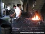 Colonial Williamsburg - Blacksmith pounding out hand made square nails - Near Virginia Beach Attraction